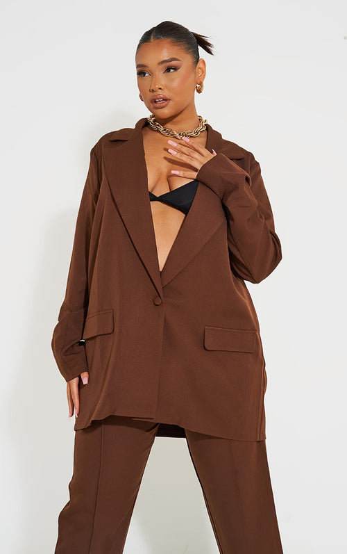A woman in brown suit